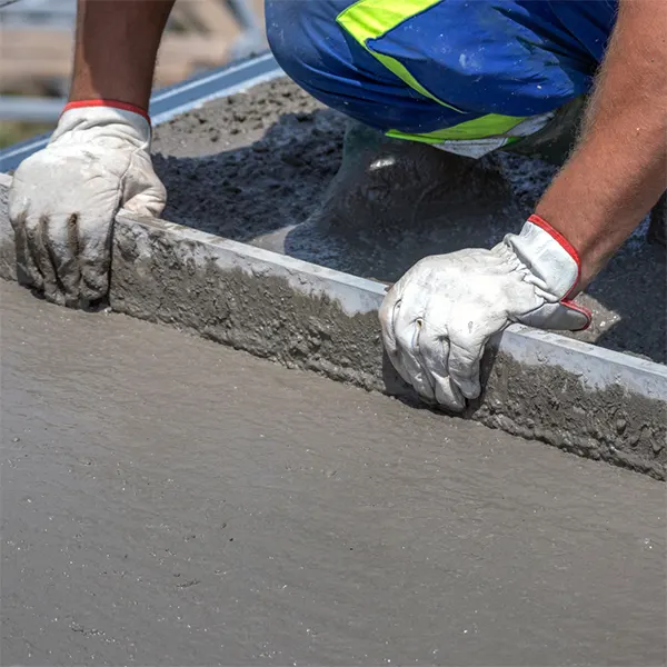 Smoothing concrete with a board