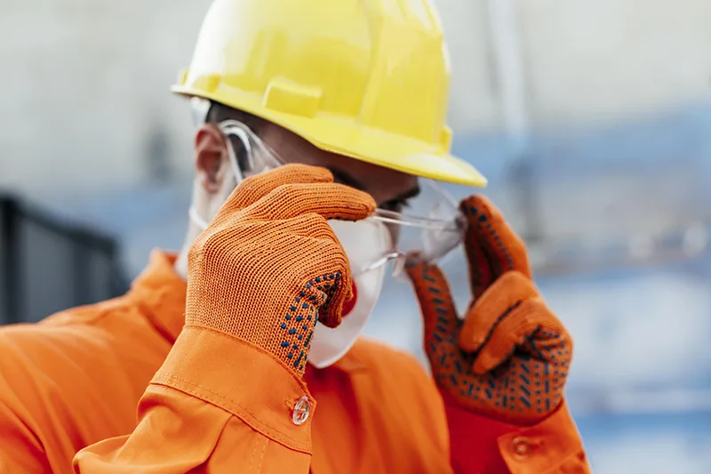 Construction worker wearing safety glasses